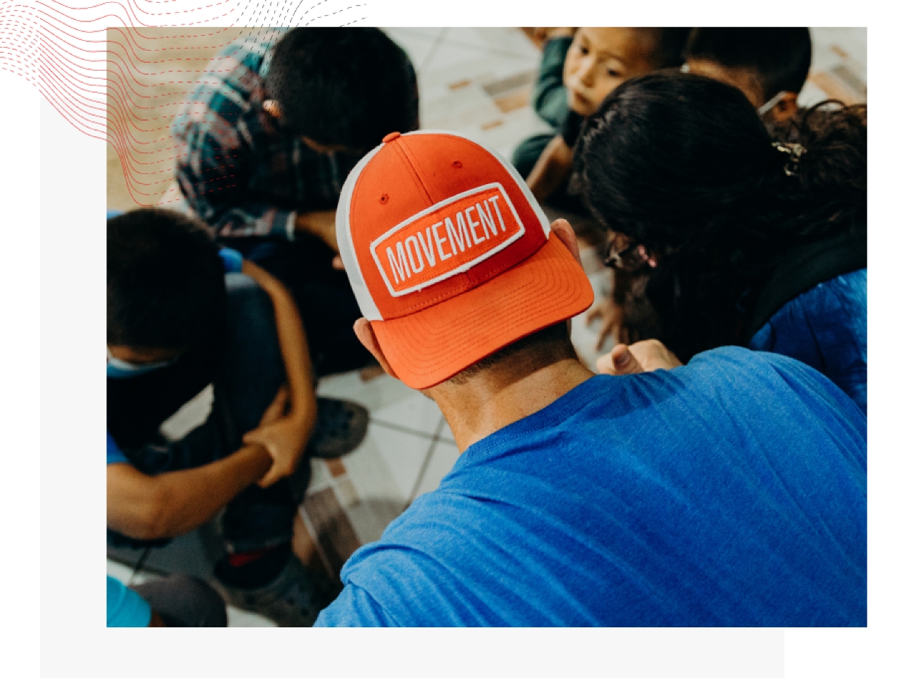 Stylized image of man facing away from camera wearing an orange hat