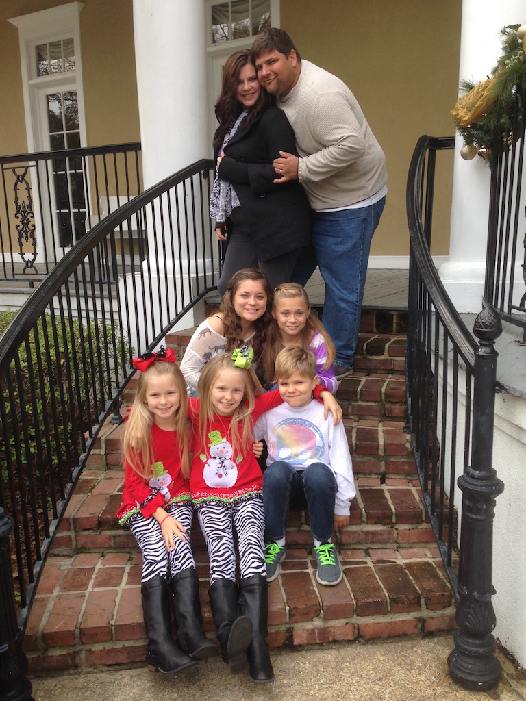 Kelly and Michael Munson and their five children are thankful to have survived the flooding in their home. Photo by Kelly Munson