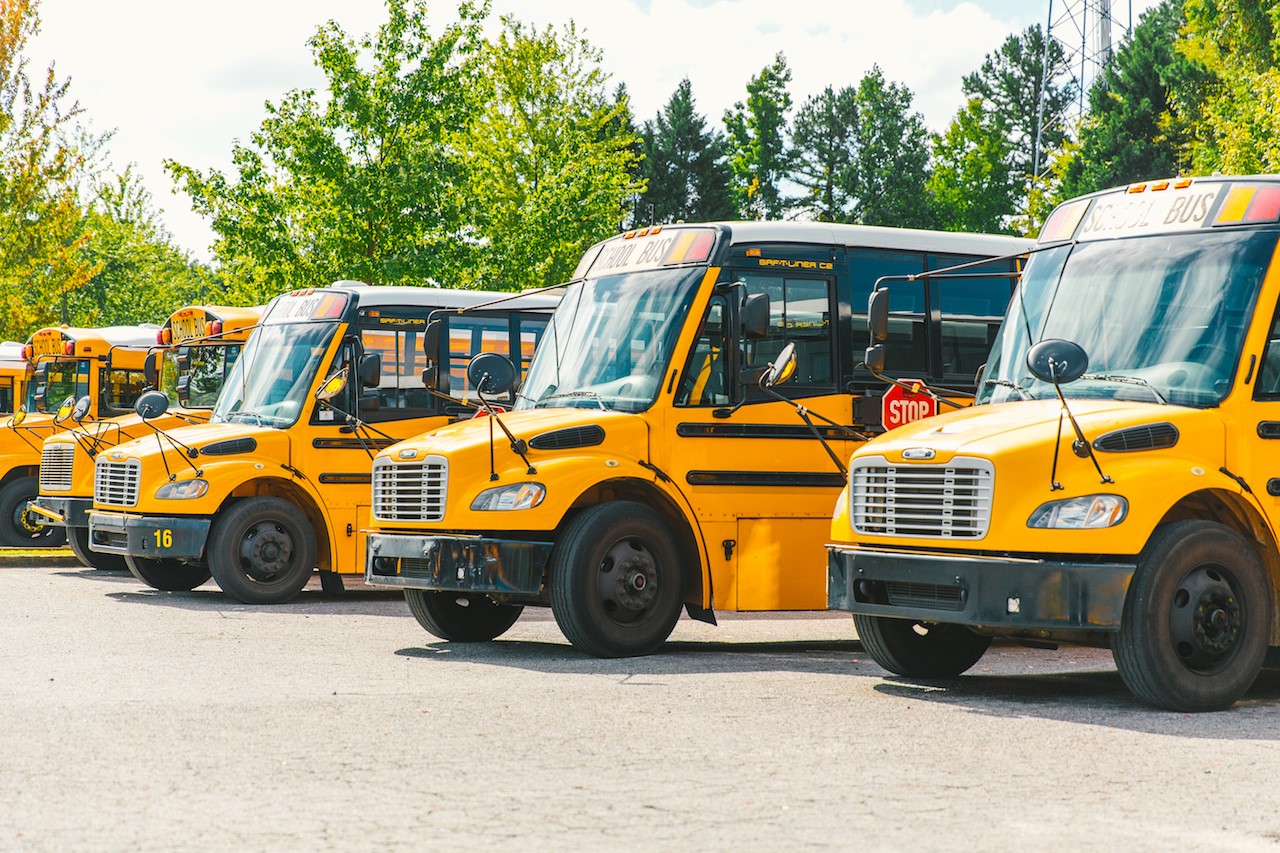 In North Carolina, charter schools are not required to provide transportation for students. Sugar Creek does. The school operates a fleet of 22 buses, which transport 80 percent of its student population five days a week. Photo by Noah Turley.