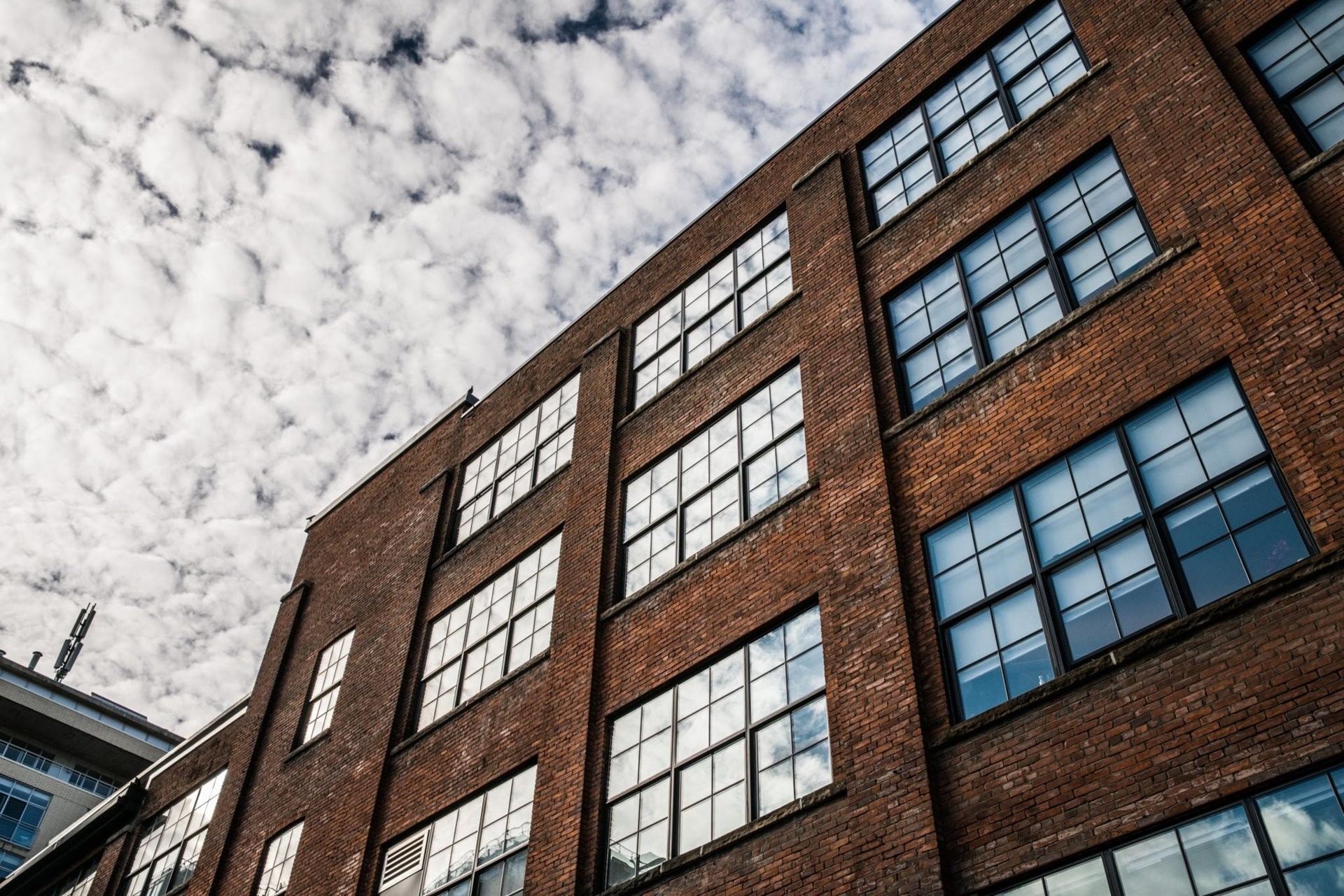 brick-buidling-under-clouds