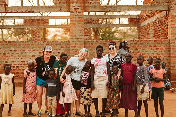 Movement teammates with children in Uganda