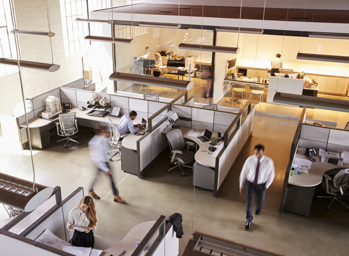 Elevated view of staff working in a busy open plan office