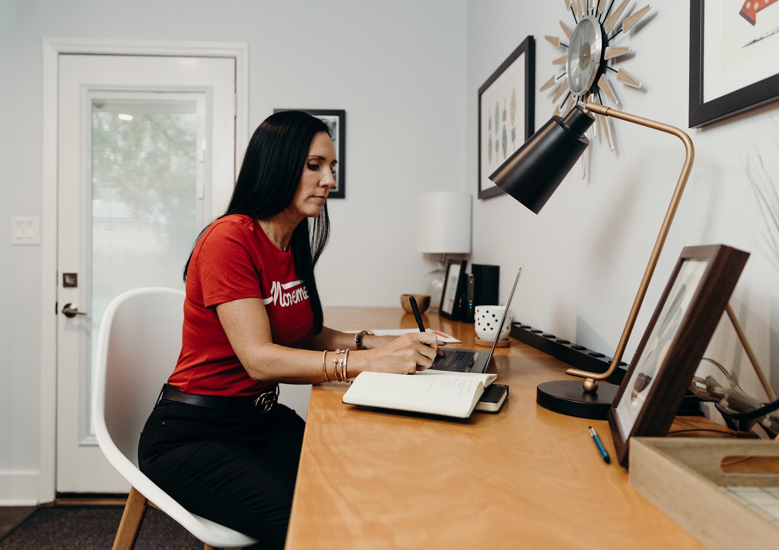 A women wearing red Movement shirt