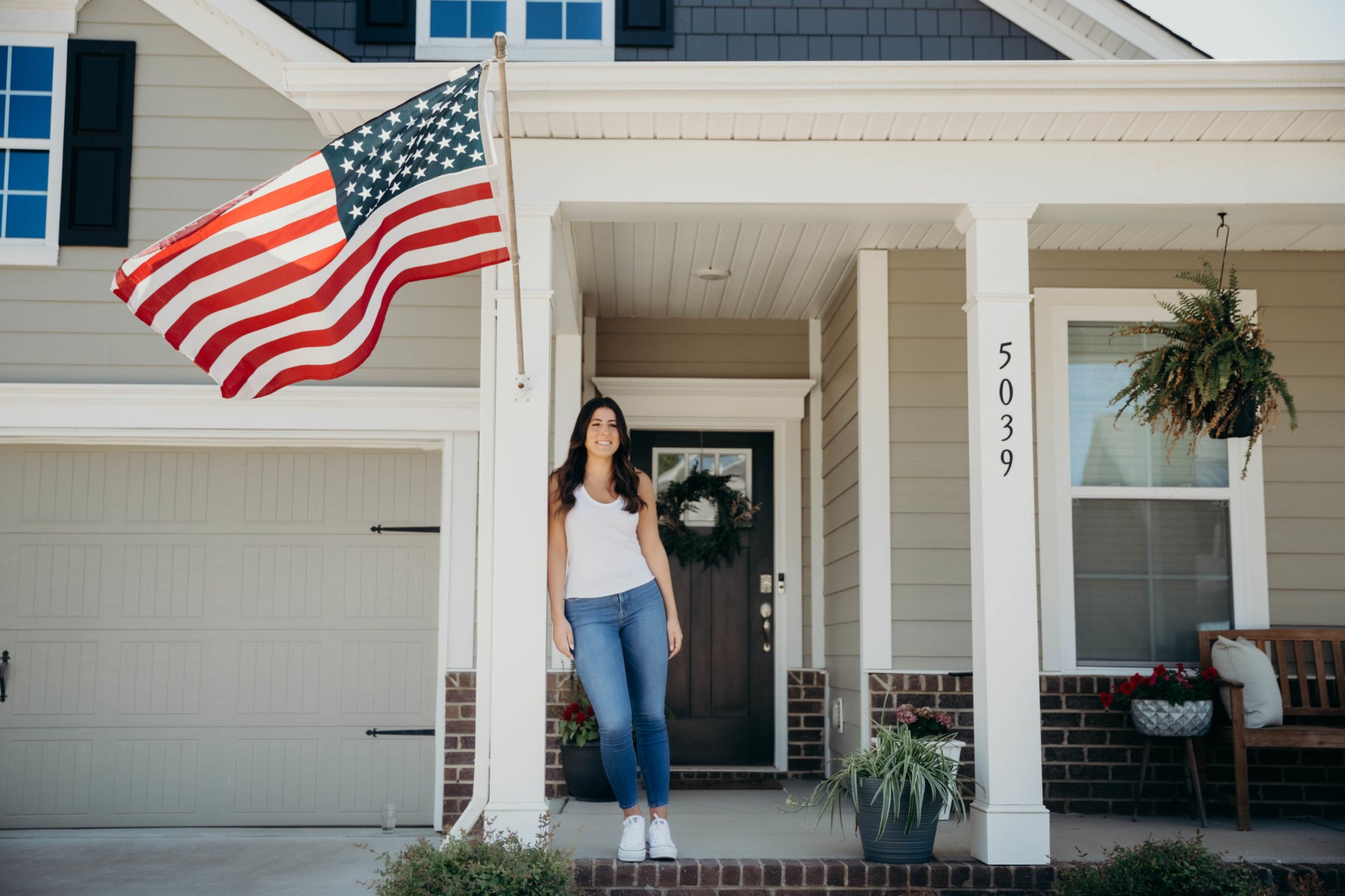 Woman standing out her home