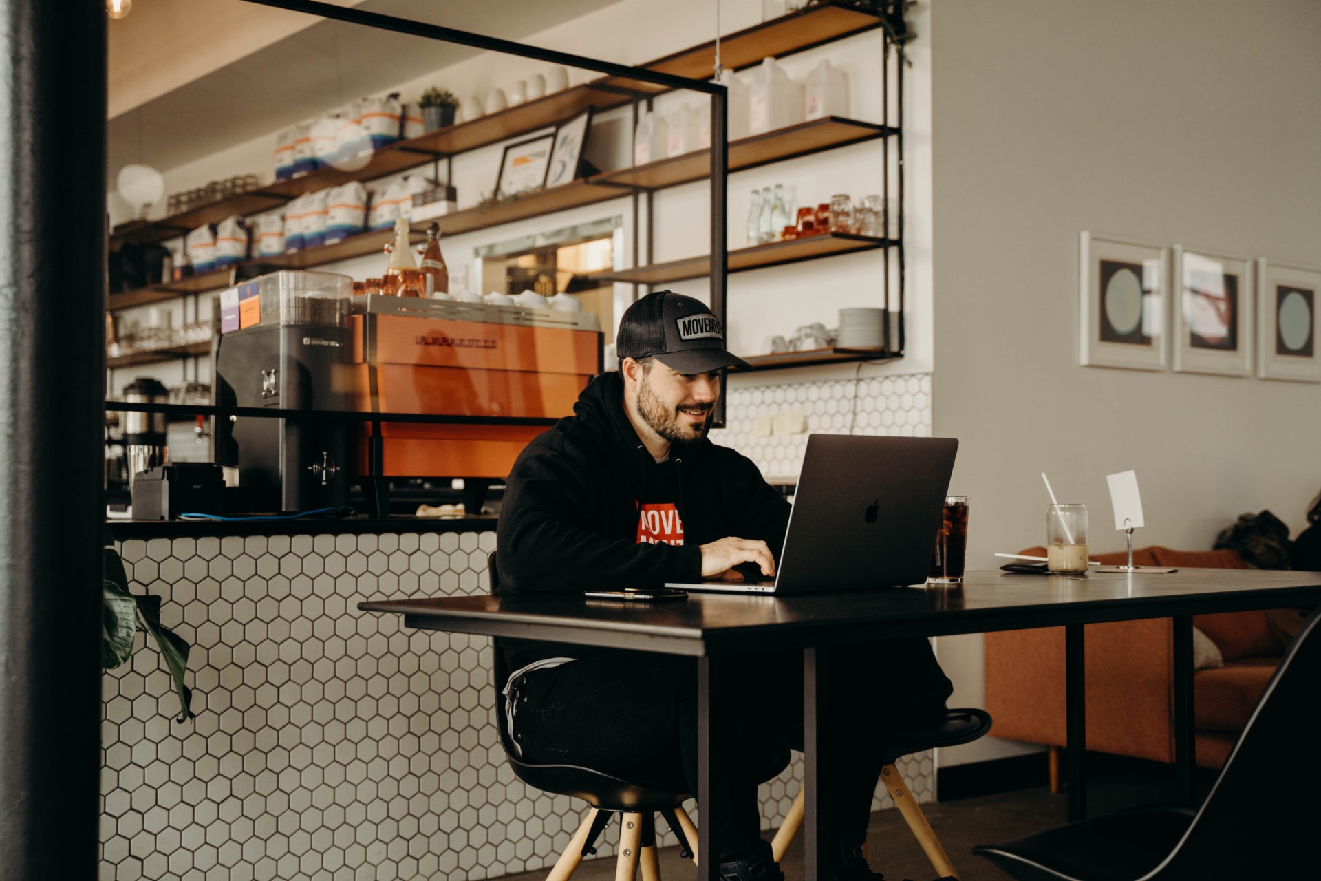 Man working on his laptop at a coffee shop