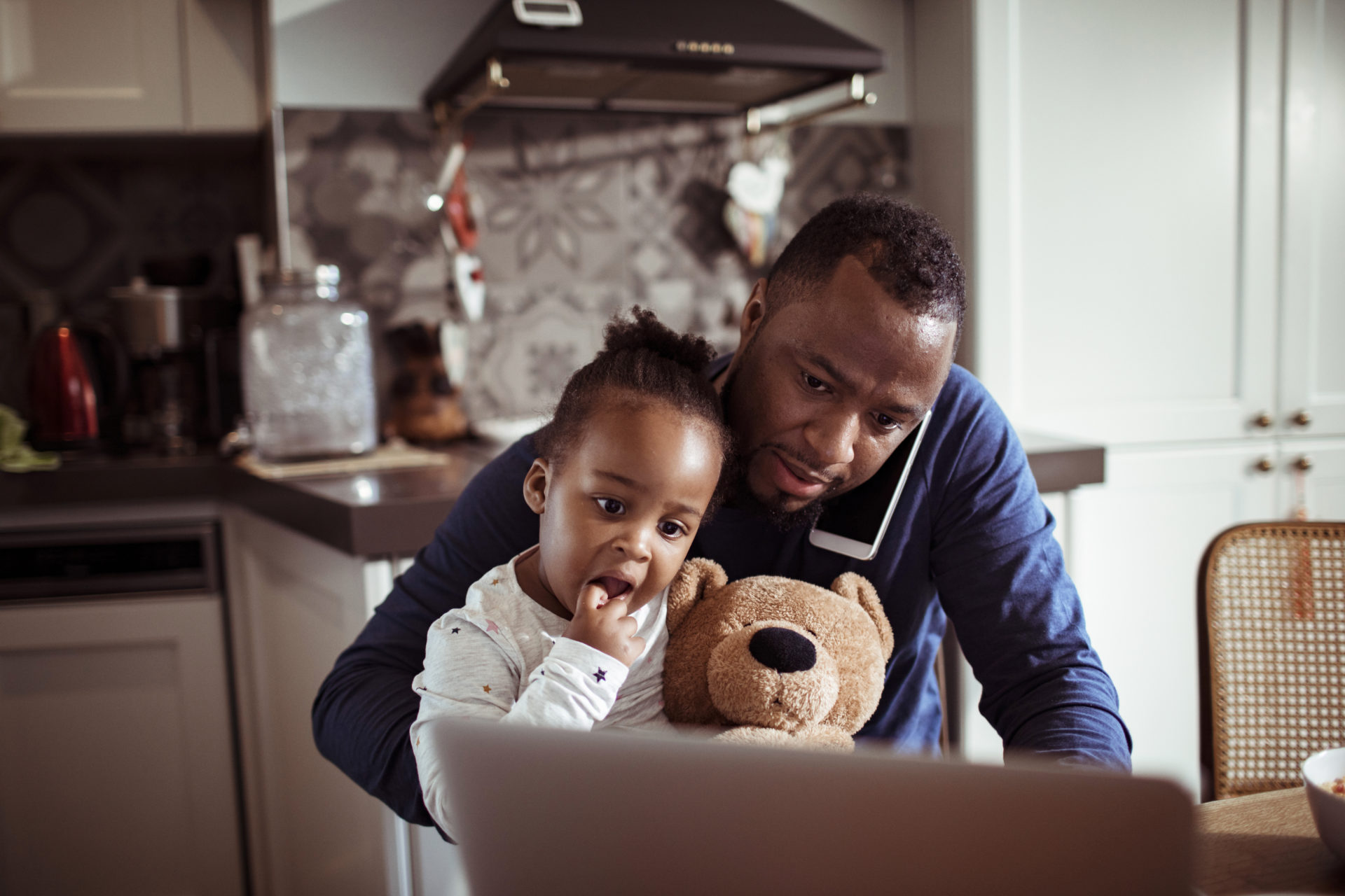 Father and Daughter using a laptop