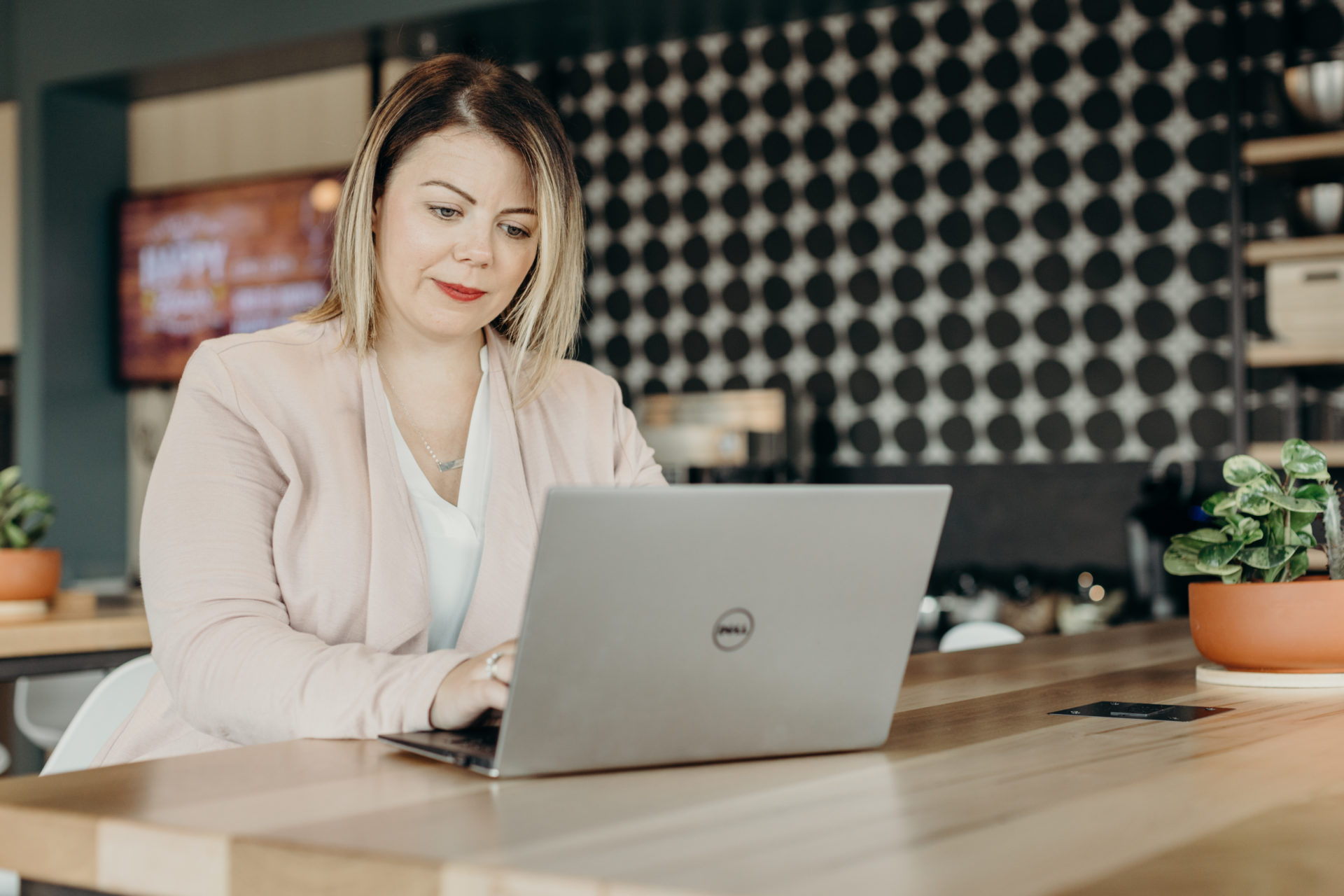 woman working on her mac laptop