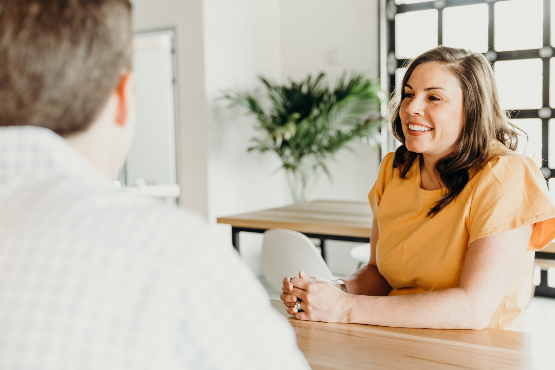 A woman and man sitting down talking