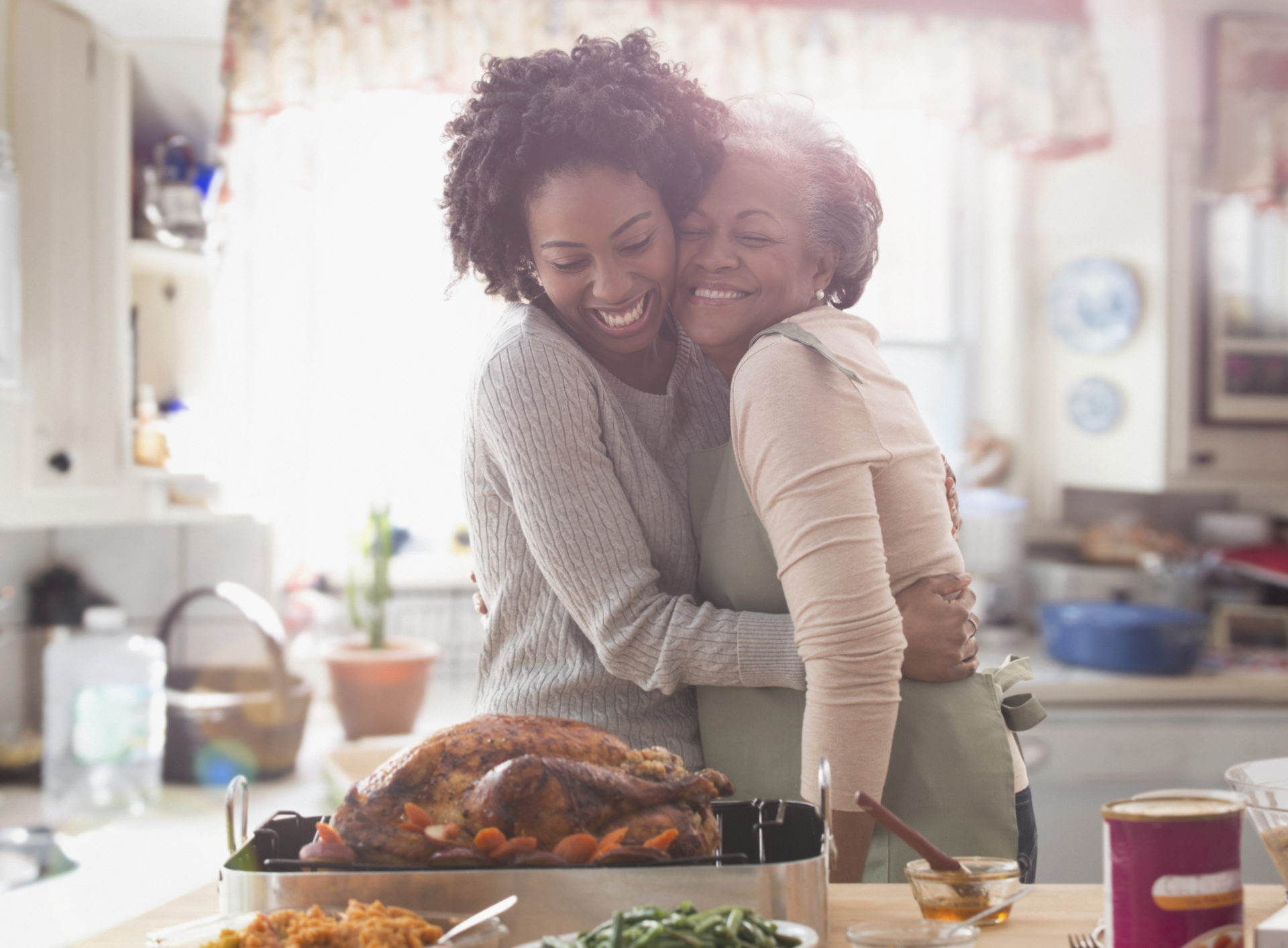 Mother and daughter cooking together in kitchen