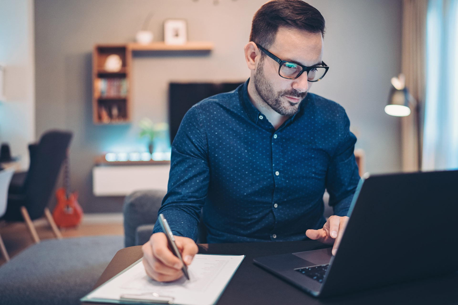 Worried businessman checking financial numbers