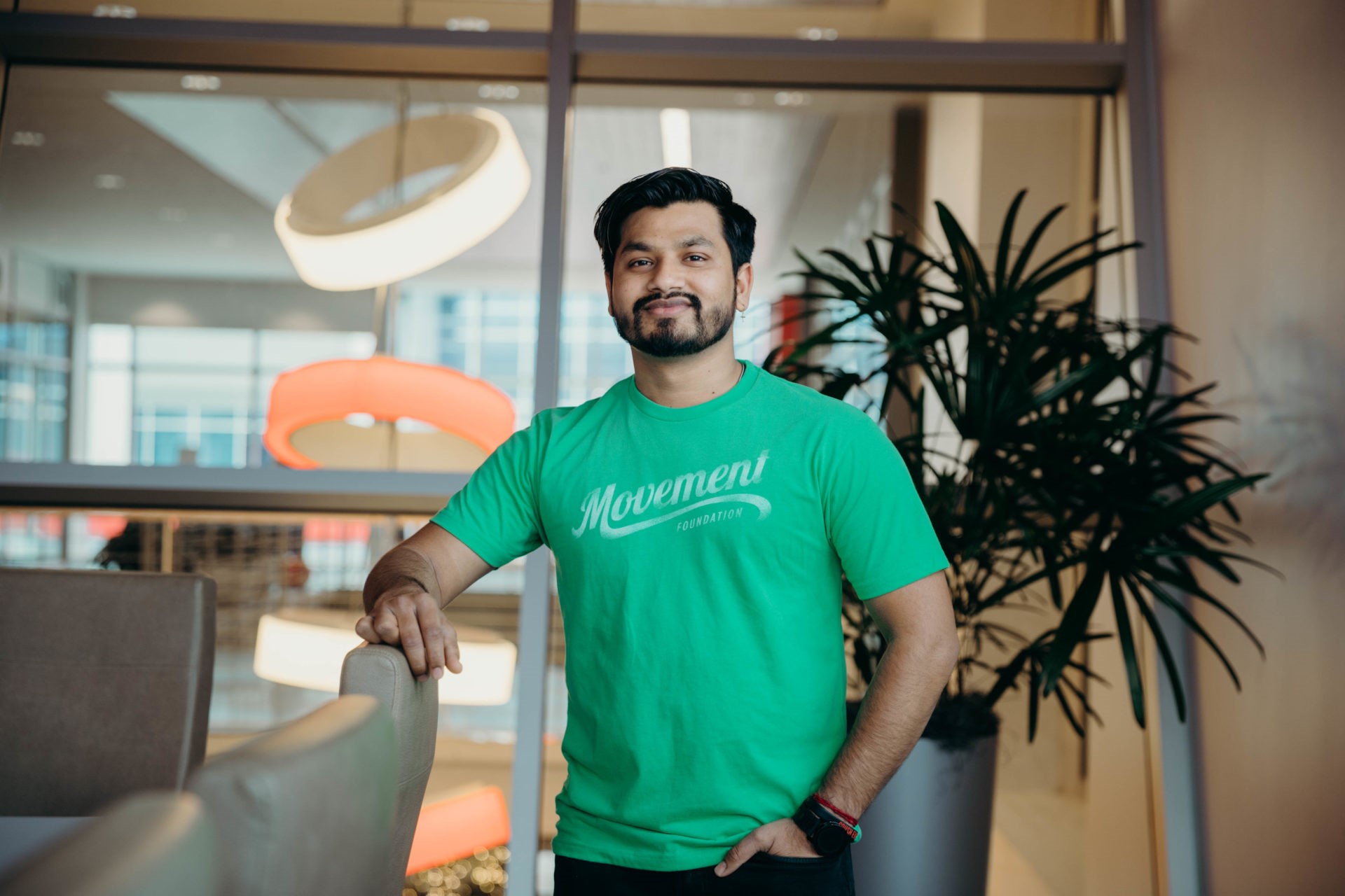 Movement Employee in light green movement shirt