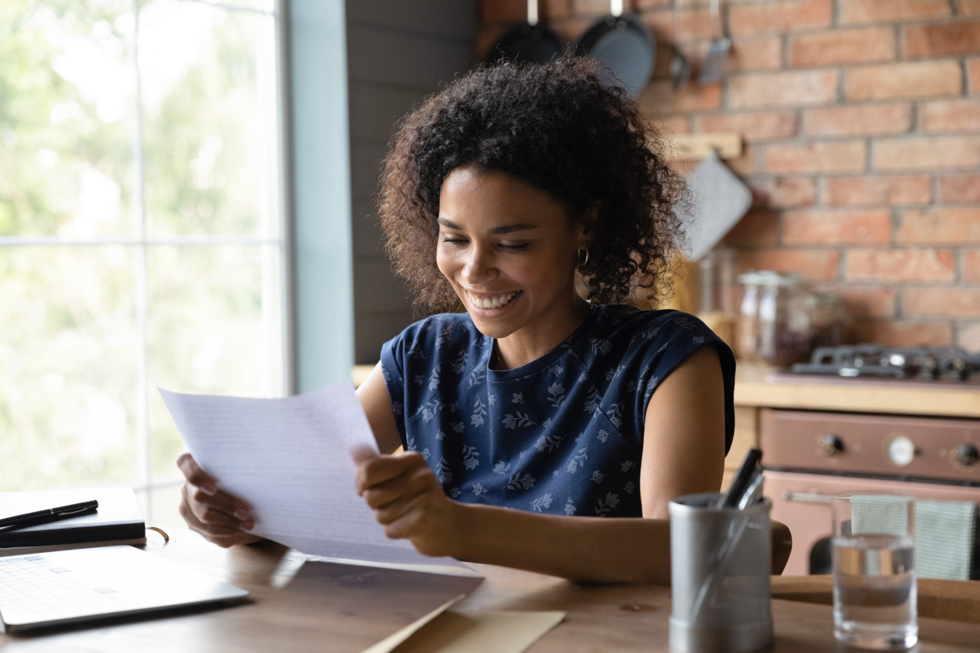 Satisfied black woman get answer about receiving loan from bank