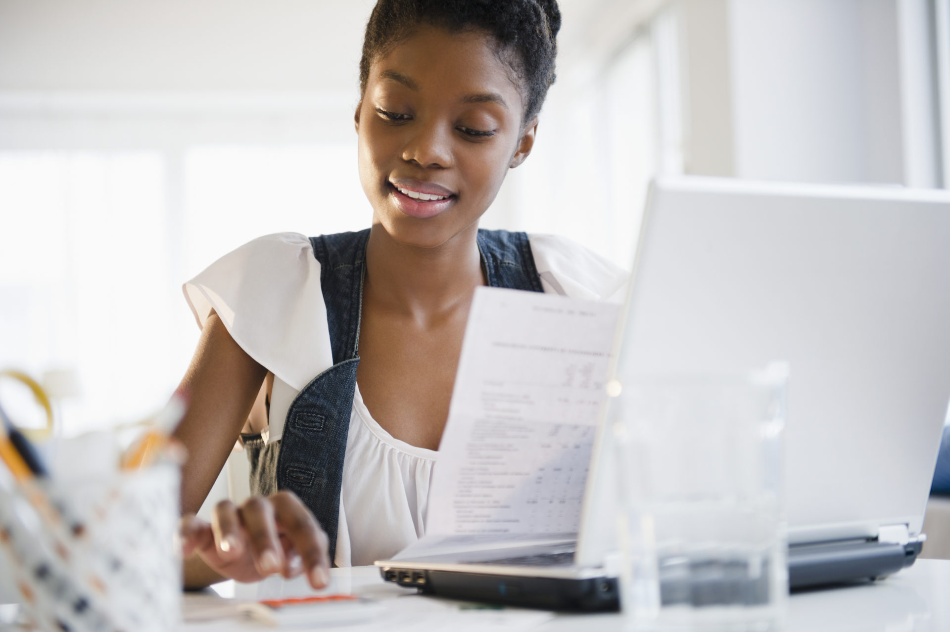 Black woman paying bills online