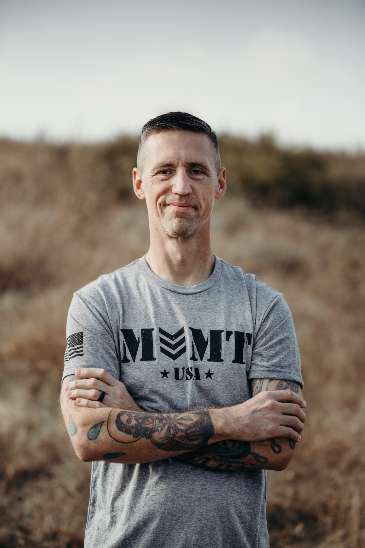 Man wearing gray movement military t-shirt 