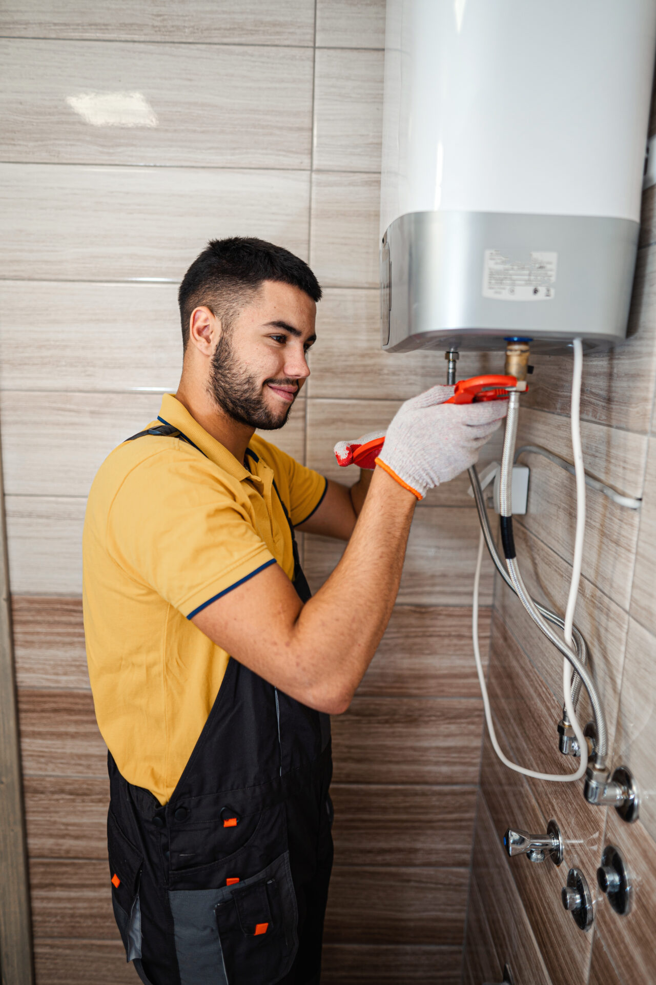 Technician repairing an hot-water heater