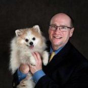 Stan Reinford headshot with dog