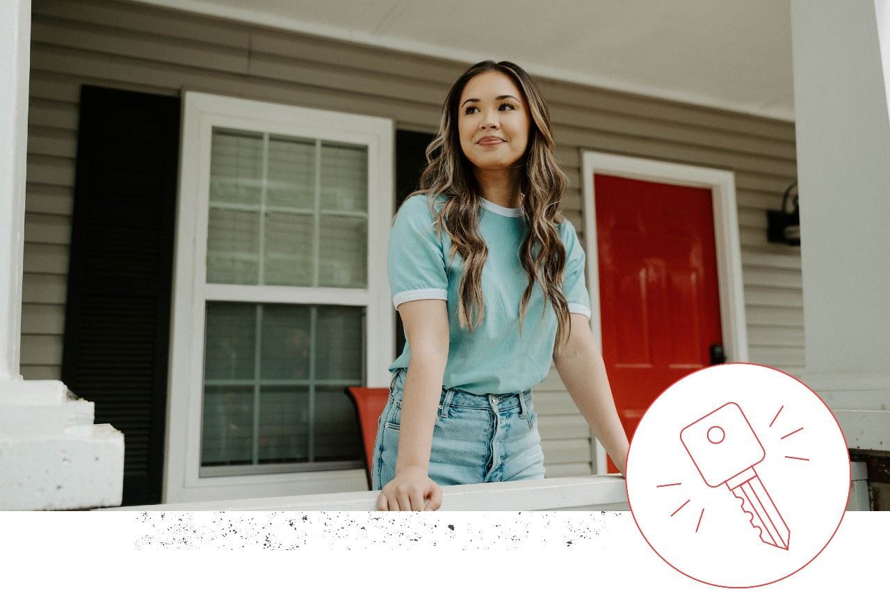 woman standing in front of home with icon in bottom right